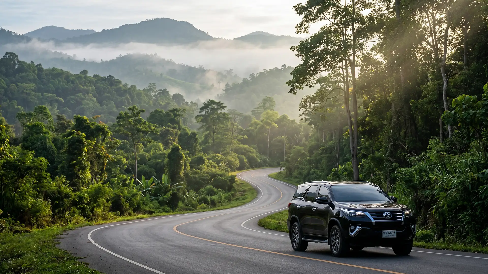 Comfortable premium sedan on a scenic Chiang Mai road — private transfer across northern Thailand